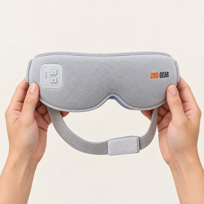 Two hands holding the CRB GEAR Reset eye massager to show its size